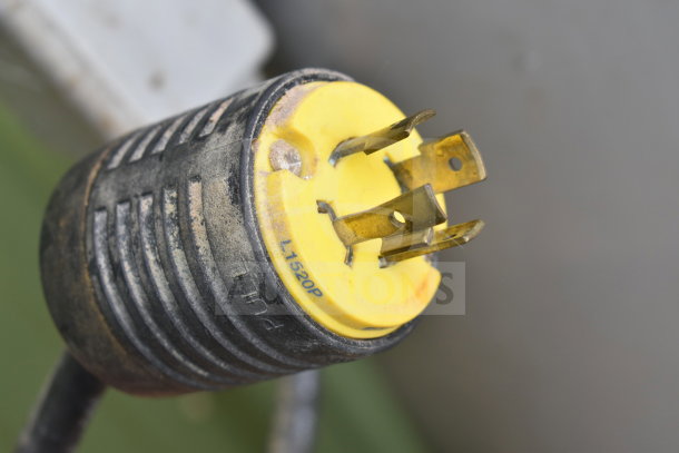 Close-up of a black and yellow electrical plug labeled "L1520P" and "PULL," related to the Hobart M-802 mixer.