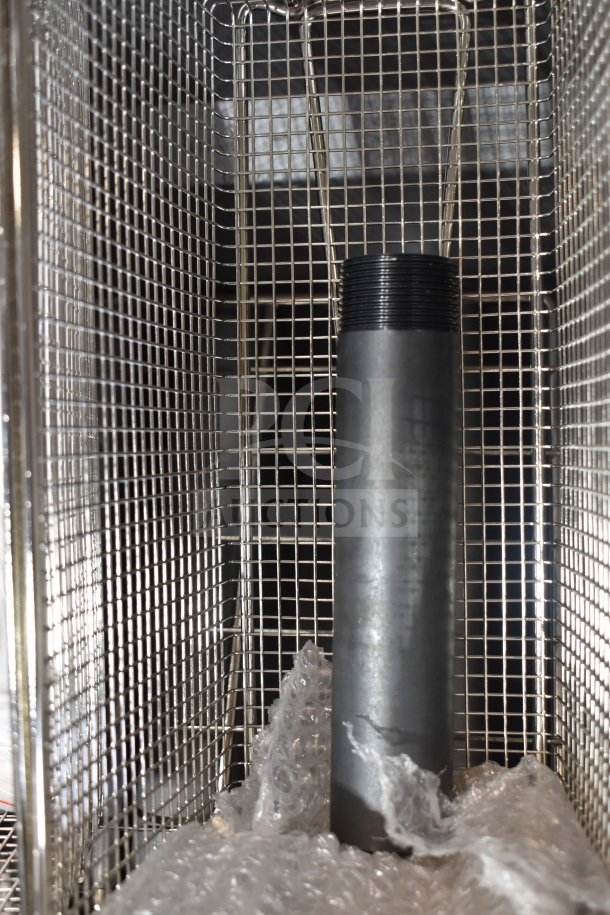 Brand new MainStreet 541FF40L 40 lb. stainless steel floor fryer, 90,000 BTU, showing interior grid and bubble wrap.