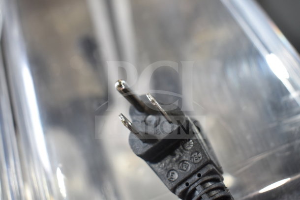Close-up of power plug for Vollrath VBBE3-37-S beverage dispenser, 115 volts, showing plug design and condition.