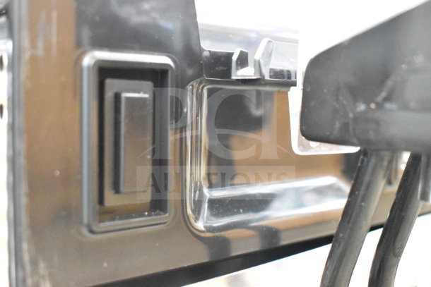 Vollrath VBBE3-37-S beverage dispenser details, showing black casing and part of the power interface. 115V, 1 Phase.