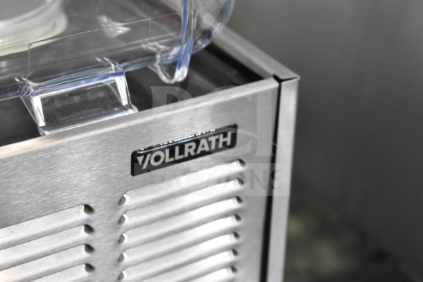 Vollrath VBBE3-37-S refrigerated beverage dispenser, stainless steel, brand label visible, new condition with minor scratches.