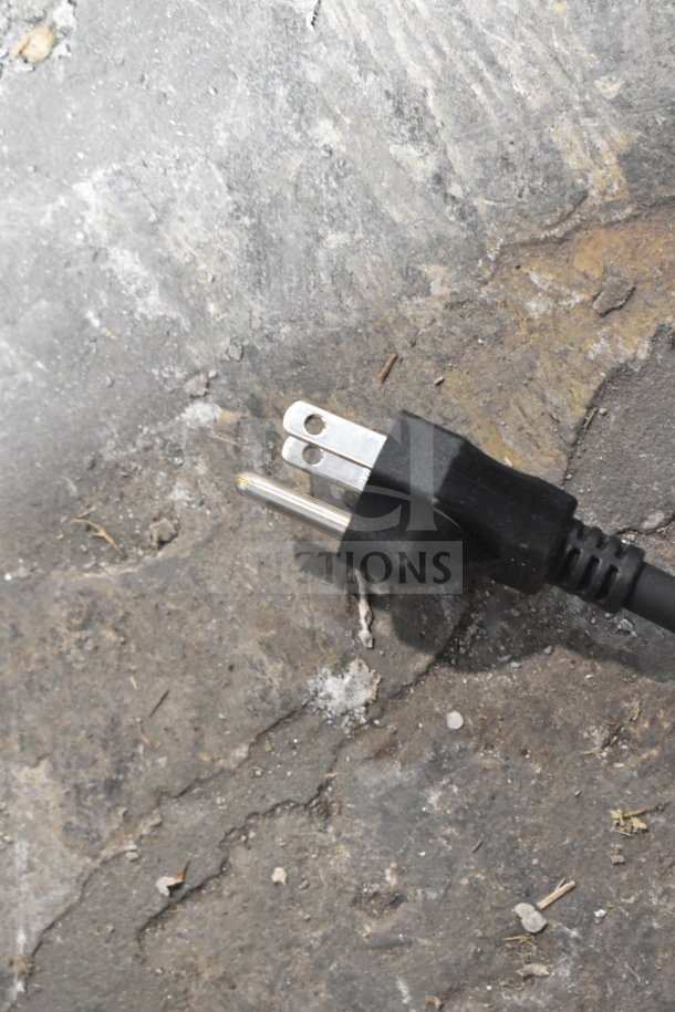 Power plug of a Bunn 58000.0012 Ultra NX slushy machine on a concrete surface. 120 Volts, 1 Phase.