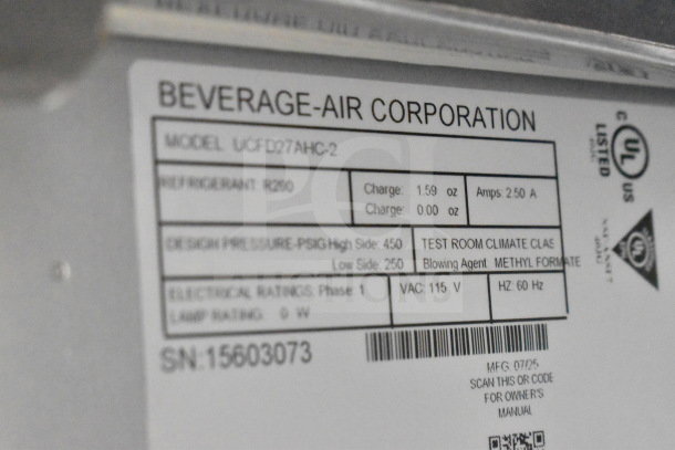 Beverage Air UCFD27AHC-2 label showing model, voltage, refrigerant info; part of commercial freezer auction.