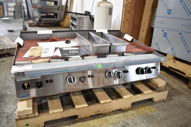 BRAND NEW Garland GTGG48-GT48M 48" Natural Gas Griddle, thermostatic controls, 112,000 BTU, minor scratches, on pallet.