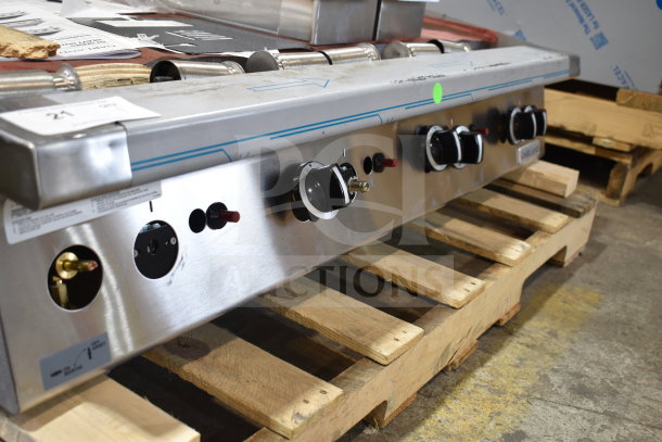 Brand new Garland GTGG48-GT48M 48" natural gas griddle, thermostatic controls, 112,000 BTU, minor scratches.
