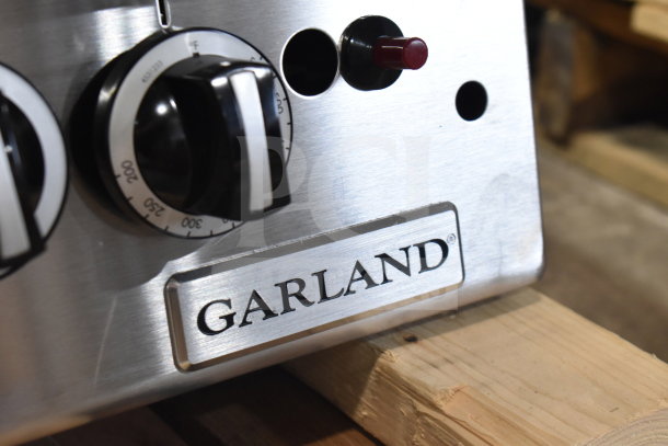 Brand new Garland GTGG48-GT48M 48" griddle, natural gas, thermostatic controls, 112,000 BTU, scratch and dent condition.