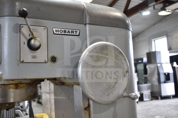 Hobart P660 commercial 60 quart dough mixer with mixing bowl and dough hook. Features speed settings. Used condition.