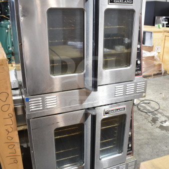 Garland Master 200 commercial convection ovens with view-through doors, thermostatic controls, and casters.