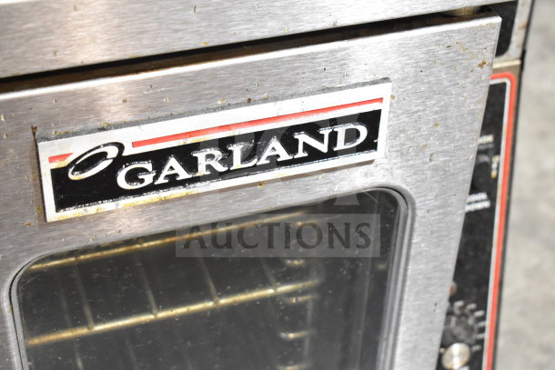 Garland Master 200 convection oven with view-through doors and thermostatic controls, mounted on commercial casters.