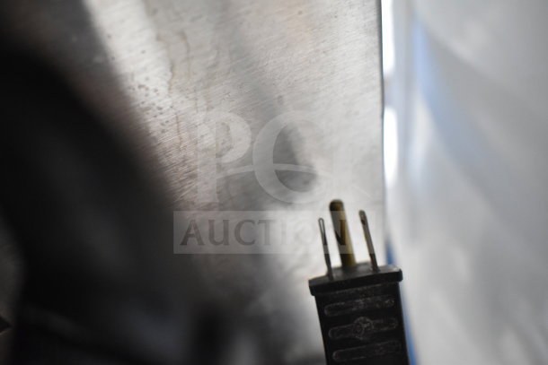 Convection oven plug, close-up, Garland Master 200 commercial series. Stainless steel texture visible.