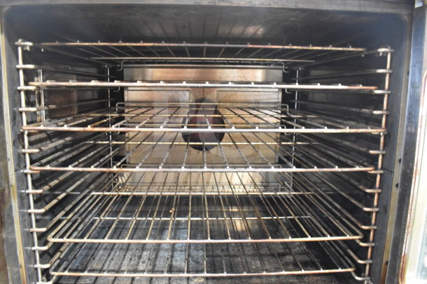 Garland Master 200 convection oven interior with multiple racks, view-through doors, and thermostatic controls on casters.