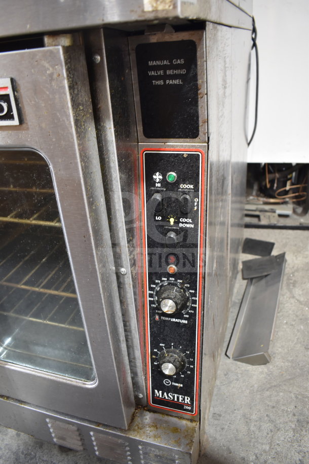Garland Master 200 commercial convection oven with view-through doors, thermostatic controls, and casters. Manual gas valve indicated.
