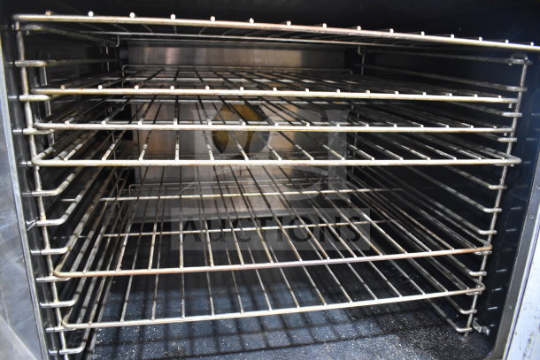 Garland Master 200 commercial convection oven interior with multiple racks, view-through doors, on commercial casters.