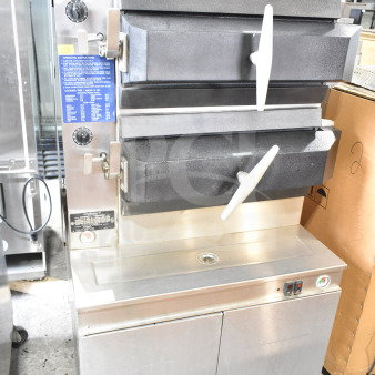 Cleveland electric double deck pressure steam cabinet, 480V, 3-phase, with control knobs and instruction labels, stainless steel.