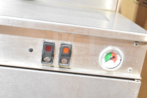 Cleveland commercial steam cabinet control panel with power and steam buttons, pressure gauge shows operational status.