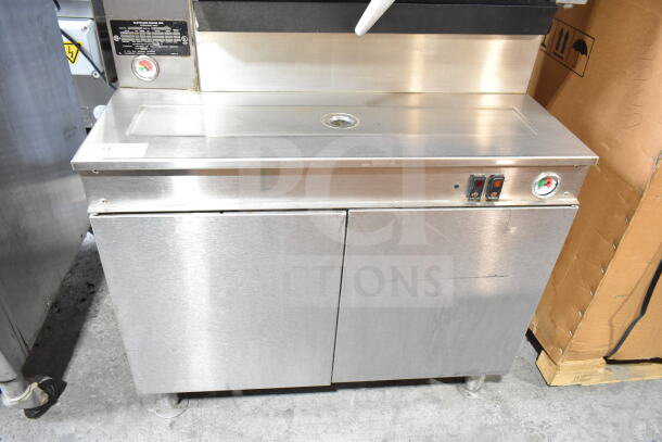 Cleveland electric double deck pressure steam cabinet, stainless steel, 480 volts, 3 phase, temperature gauges, control switches.