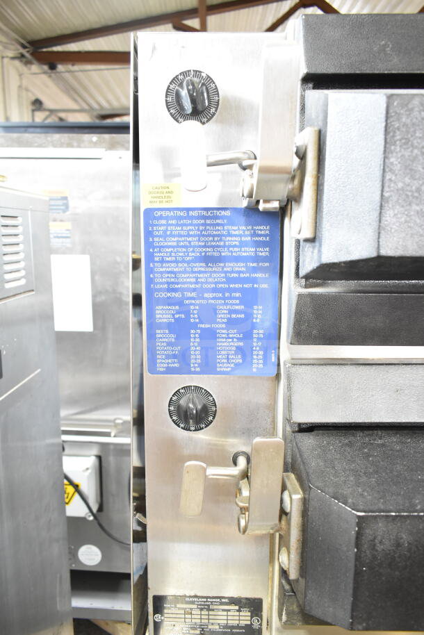 Cleveland Commercial Electric Double Deck Pressure Steam Cabinet, 480V, 3 Phase, with visible operating instructions and dials.