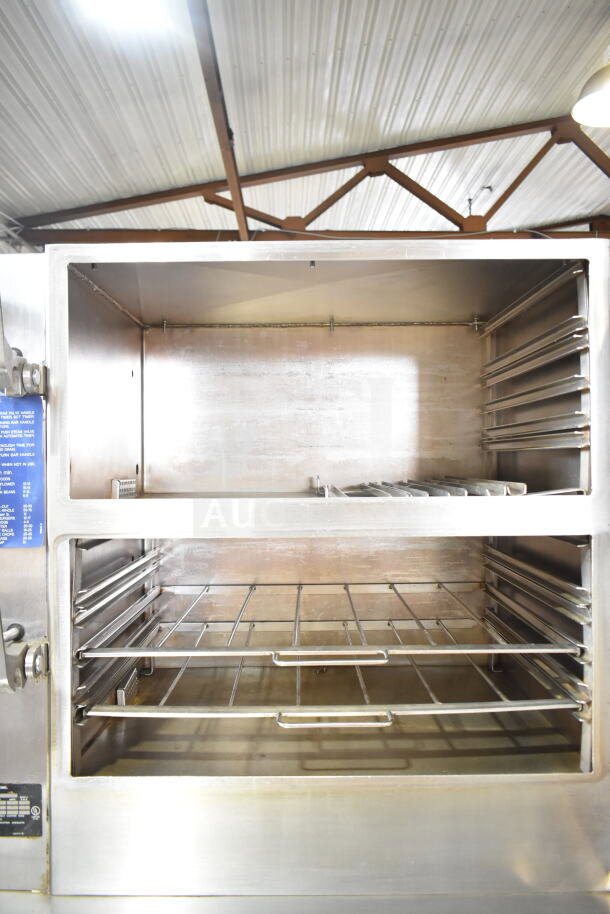 Cleveland Commercial Electric Double Deck Pressure Steam Cabinet, 480V, 3 Phase, stainless steel, racks visible, good condition.