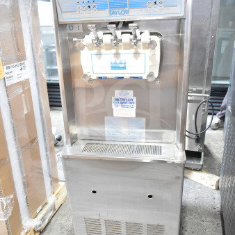 Taylor commercial water-cooled two-flavor soft serve ice cream machine with twist feature, on casters.
