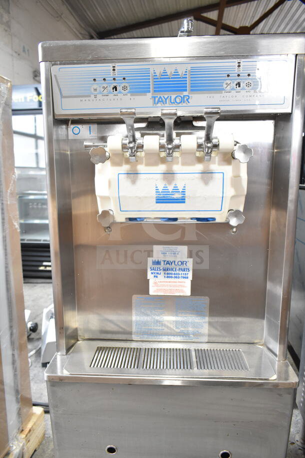Taylor commercial water-cooled 2-flavor twist soft serve ice cream machine on casters, stainless steel, used condition.