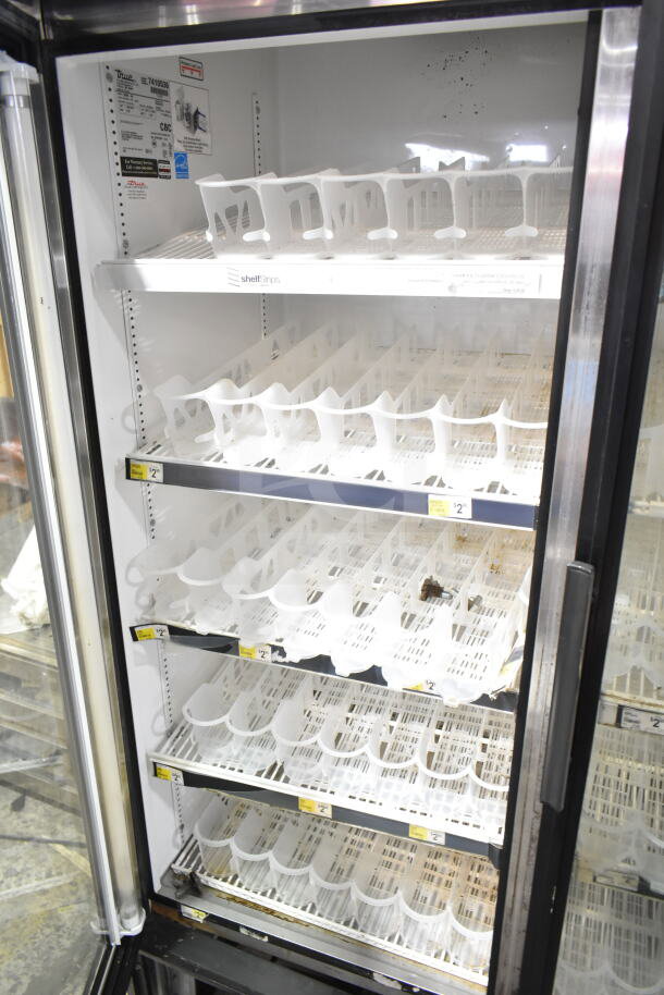 True Commercial 2 Door Reach In Cooler Merchandiser, 115 Volts, 1 Phase, visible shelves and door tags, used condition.