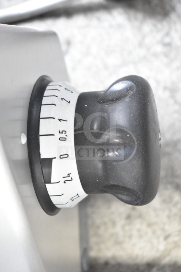 2017 Bizerba GSP HD meat slicer control knob, shown with precision measurement markings, durable condition.