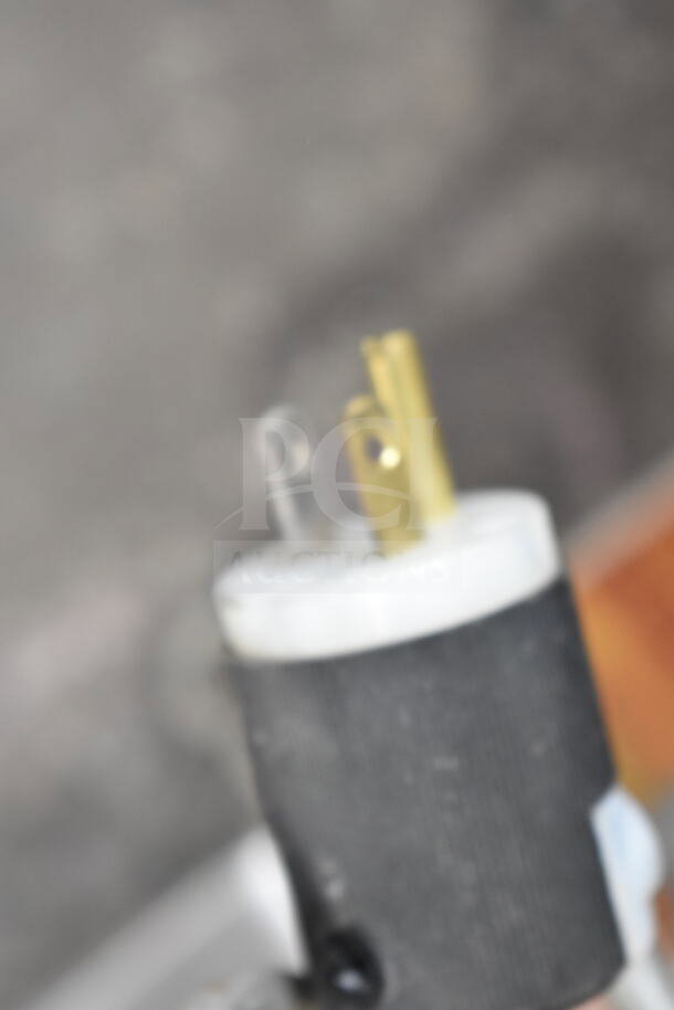 Three-prong plug attached to the Bizerba SE 12 U Commercial Meat Slicer, 120 volts, 1 phase.