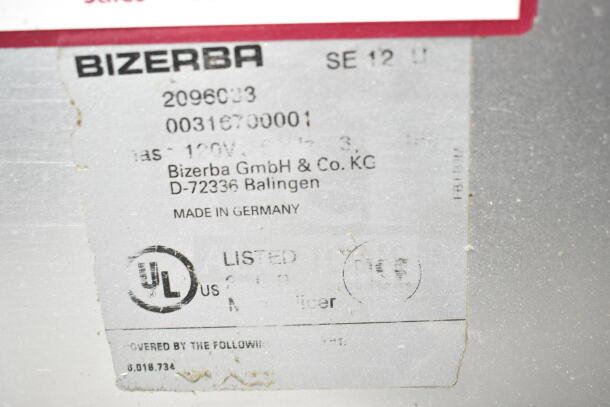 Bizerba SE 12 U meat slicer label showing model, voltage, and UL listing. Made in Germany.