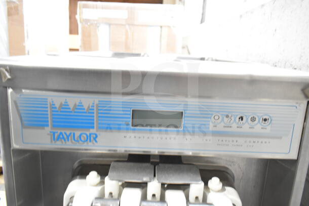 Taylor countertop soft serve machine, two flavors plus twist, 208/240V, brand logo and controls visible, good condition.