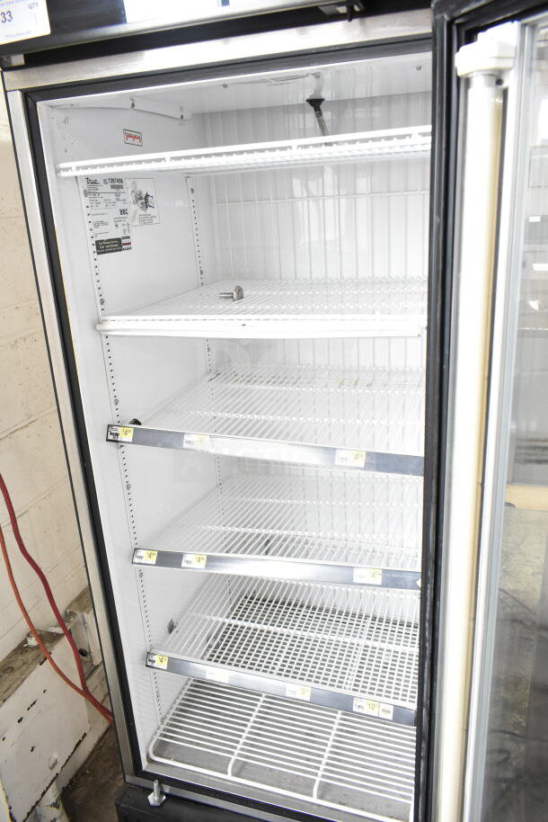 True GDM-23F commercial freezer, single door, clean interior, adjustable shelves, 115 volts, 1 phase.