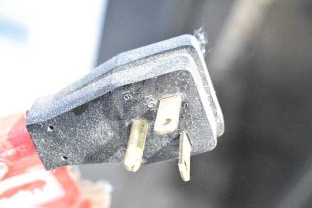 Close-up of power plug for True GDM-23F Freezer Merchandiser, 115V, illustrating compatibility and connections.