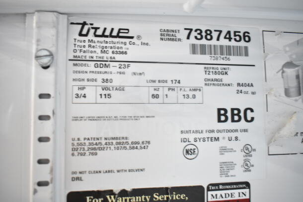 True GDM-23F Commercial Freezer label, 115 volts, single-phase, R404A refrigerant, NSF certified, suitable for outdoor use.