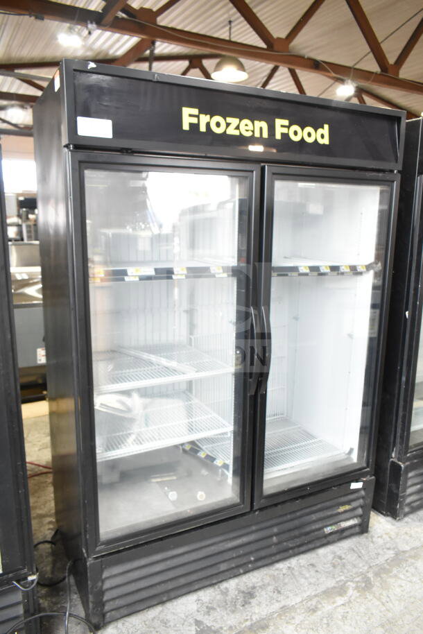 2016 True GDM-49F-HC commercial 2-door freezer merchandiser, black exterior, clear doors, "Frozen Food" label, excellent condition.
