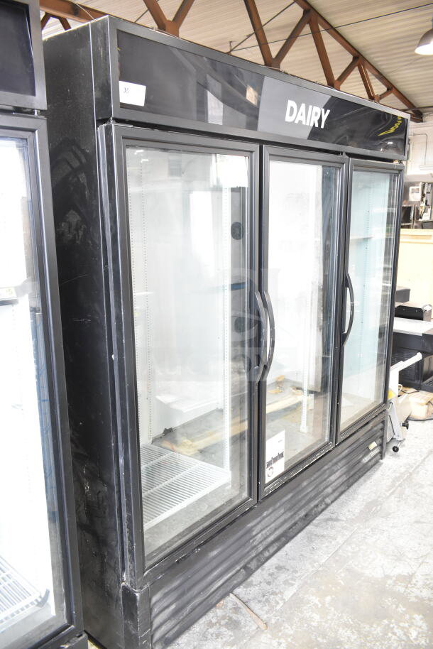 2019 True GDM-72-HC 3 Door Reach-In Cooler Merchandiser, black exterior, with "DAIRY" header. 115 Volts, 1 Phase.