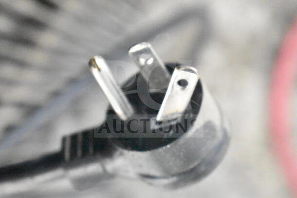 Close-up of a three-prong electrical plug belonging to a 2019 True GDM-72-HC commercial cooler.