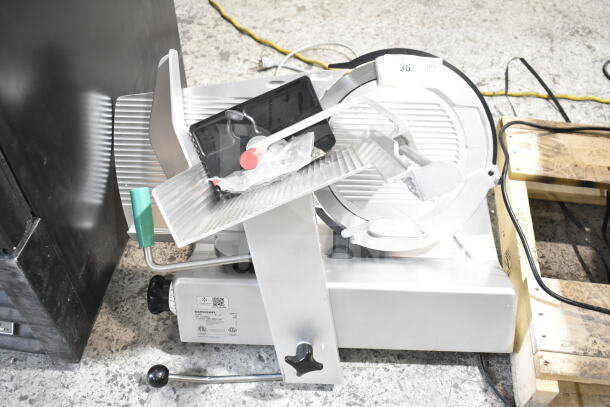2017 Bizerba GSP H commercial meat slicer, 120V, 1 phase. Silver with green handle, in good condition.