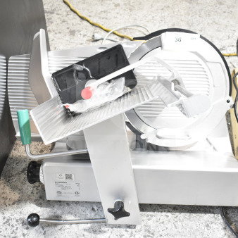 2017 Bizerba GSP H commercial meat slicer, 120V, 1 phase. Silver with green handle, in good condition.