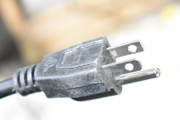 Close-up of a black electrical plug for the 2025 Bunn 22100.0000 G3 HD 3 lb. Black Bulk Coffee Grinder.