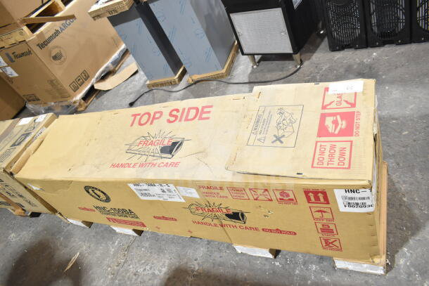 Brand new Hoshizaki HNC-150BA-R-S sushi display case in original packaging, 59", curved glass, minor dents noted.