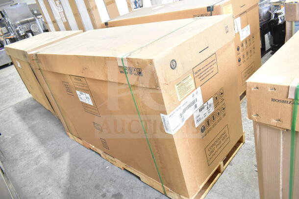 Brand new Hoshizaki BB69-S stainless steel back bar refrigerator in box, visible model label, 115 volts, 1 phase.