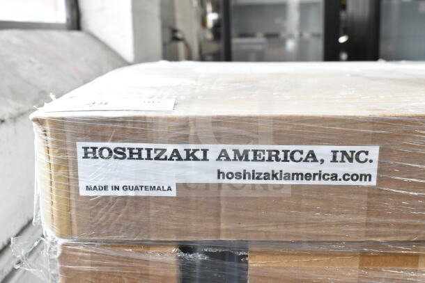Packaging for a Hoshizaki RM-7-HC-WHT glass door refrigerator, showing "Made in Guatemala" and Hoshizaki America, Inc. label.