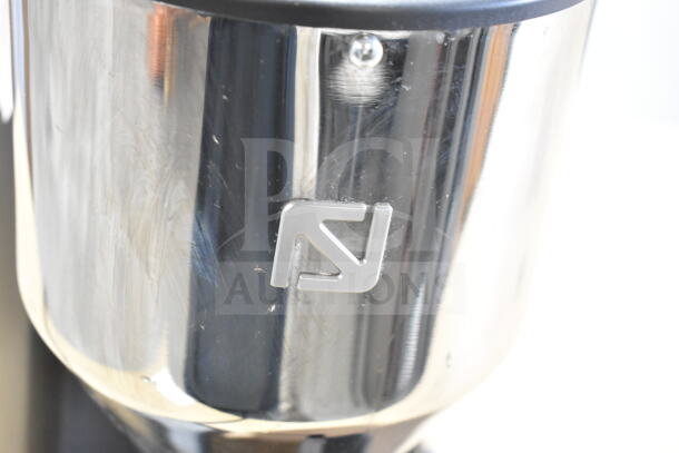 Nuova Simonelli G60OD espresso grinder, metallic finish, logo visible. 110 Volts, 1 Phase. Commercial 1 lb. capacity.