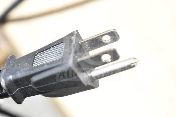 Black power plug for Nuova Simonelli G60OD commercial espresso grinder, 110 volts, 1 phase, close-up view.