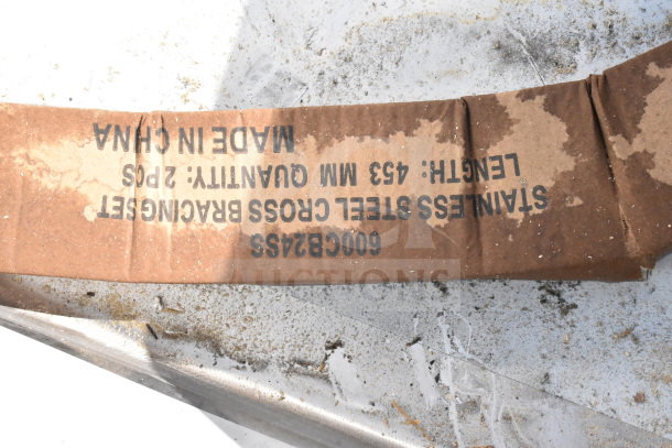Cardboard packaging on Regency 600S22424224 commercial sink shows text: "455 MM QUANTITY: 2 PCS," "MADE IN CHINA," and "STAINLESS STEEL."