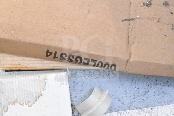 Cardboard packaging with "REGSS014" label, partially obscured. Possible contents: Regency 600S22424224 sink.