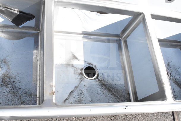 BRAND NEW SCRATCH AND DENT Regency 600S32424218 Commercial 3 Bay Sink with dual drain boards, no legs, slight surface marks.