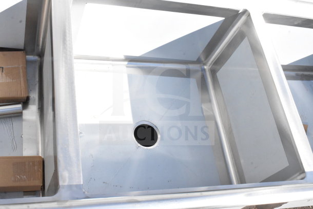 BRAND NEW Regency 600S32424224 commercial 3 bay sink with dual drainboards. Scratch and dent condition.