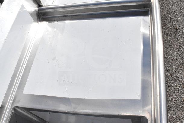 Brand new Regency 600S32424224 commercial 3-bay sink with dual drain boards; minor scratches visible.