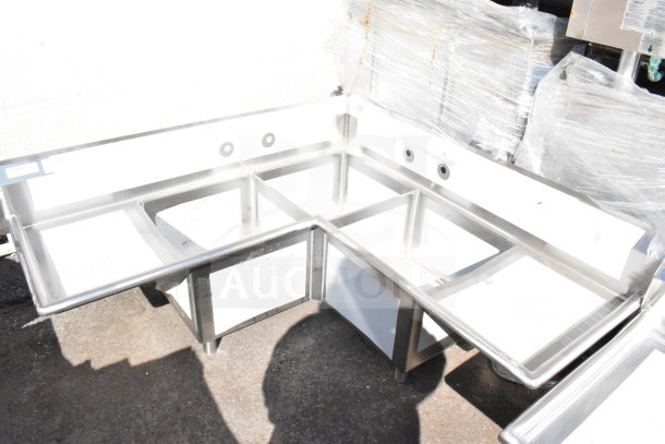 Brand new Regency 600S32020C commercial L-shaped sink with 3 bays, dual drain boards, and no legs. Scratch and dent.