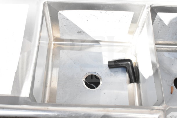 Brand new Regency 600S32020C commercial 3-bay L-shaped sink with dual drain boards, scratch and dent, no legs.